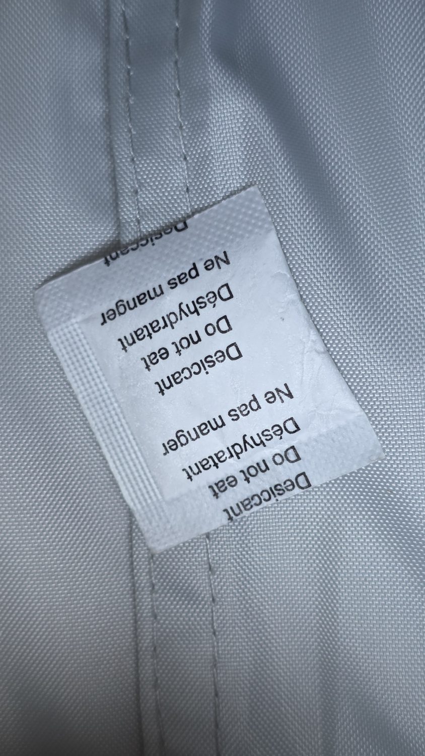 A desiccant packet tucked into a camera bag.