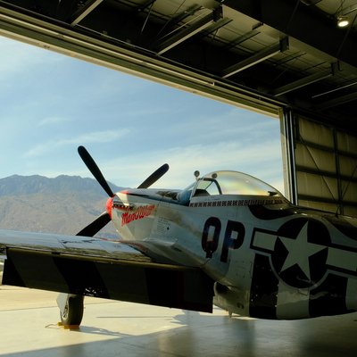 P-51D Mustang Man O War on display at Palm Springs Air Museum with San Jacinto Mountains in background, California